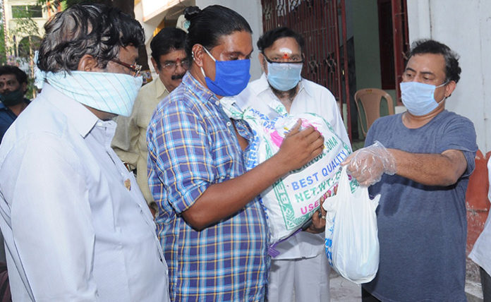 Film Writer Burra sai Madhav distributed Daily needs for Poor Artists Film Writer Burra sai Madhav distributed Daily needs for Poor Artists